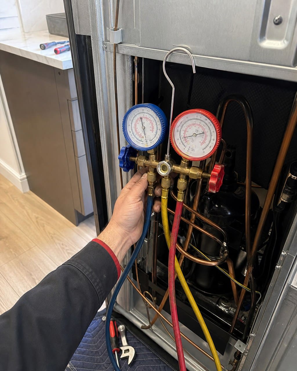 Technician locating a noise source on a Sub-Zero sealed system in Santa Clara